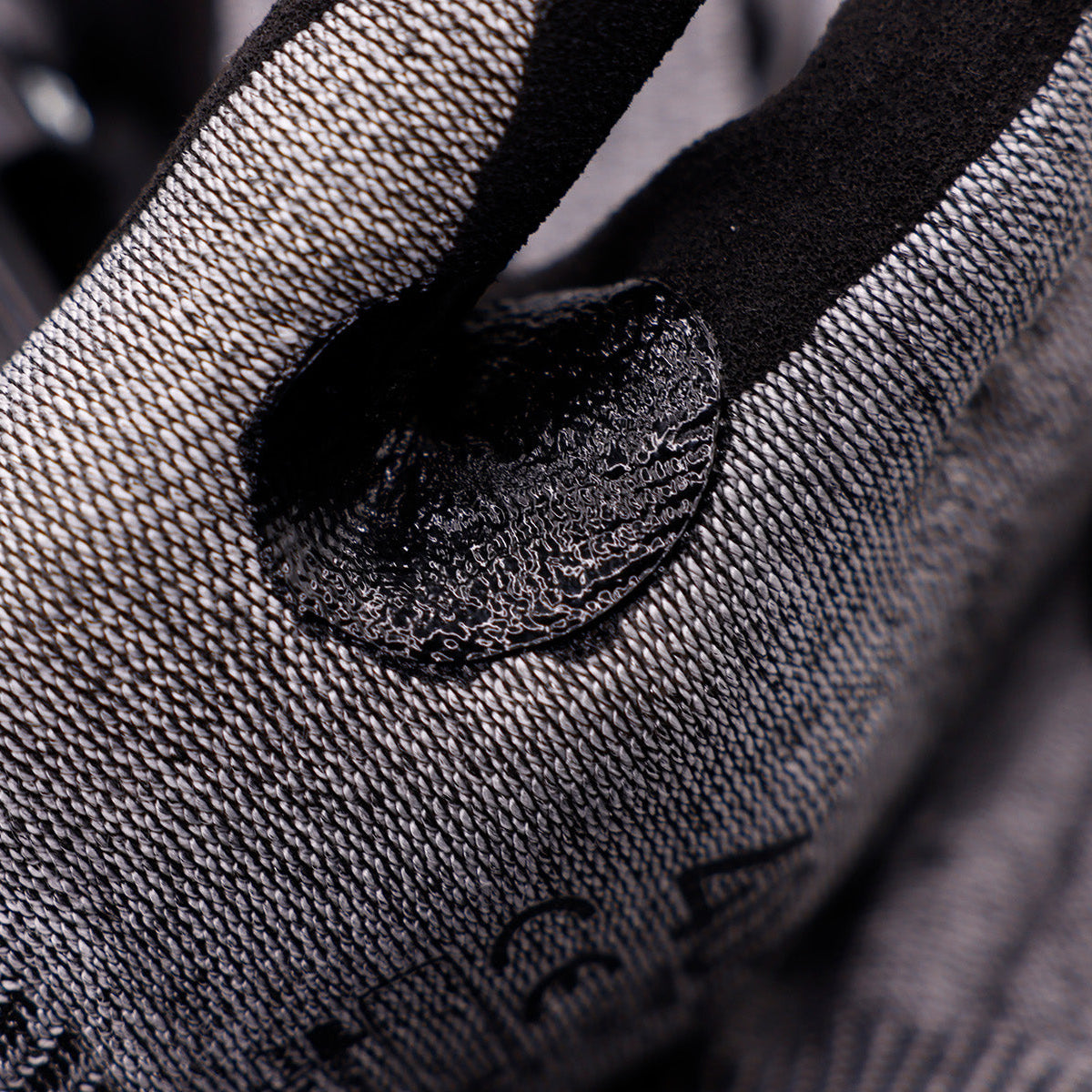 Aurelia 406 Cut F protective glove with black sandy nitrile coating